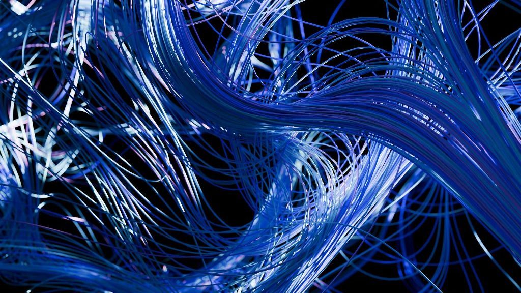 2Connect, Entwined blue and white fiber optic cables creating an intricate, illuminated pattern. 3D rendering (Photo by Sergio Bonilla / Connect Images via AFP)