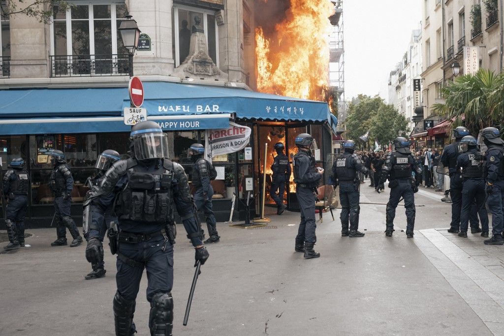 During a confrontation in Paris, a fire broke out at a restaurant, partially burning the establishment and damaging a nearby building. September 10, 2025. Part of the nationwide "Block Everything" demonstrations, the protests were sparked by opposition to austerity measures and widespread political dissatisfaction. (Photo by Sami Boudra / Middle East Images via AFP)