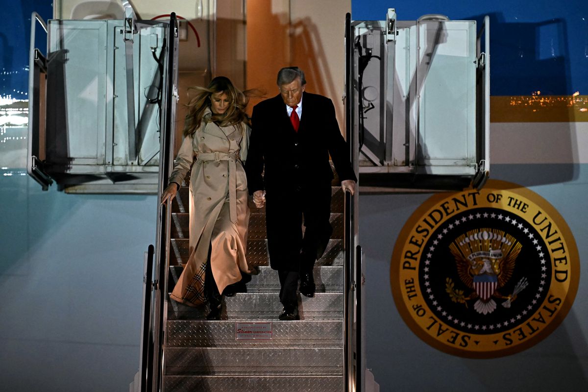 US President Donald Trump and US First Lady Melania Trump disembark from Air Force One after landing at Stansted Airport, eastern England, on September 16, 2025, on the first day of a two-day visit to the UK. US President Donald Trump arrived in the UK late Tuesday for a State Visit with his wife, Melania, a rare privilege made at the invitation of King Charles III. (Photo by Paul ELLIS / AFP)