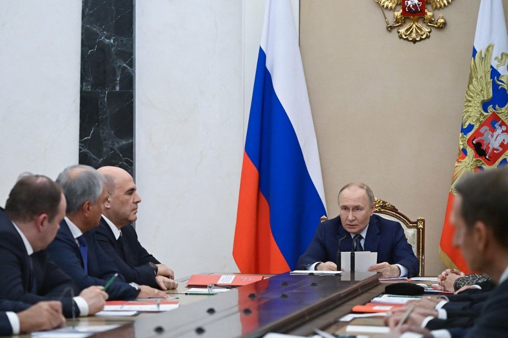 In this pool photograph distributed by the Russian state agency Sputnik, Russia's President Vladimir Putin chairs a Security Council meeting at the Kremlin in Moscow on September 22, 2025. (Photo by Alexander KAZAKOV / POOL / AFP)
