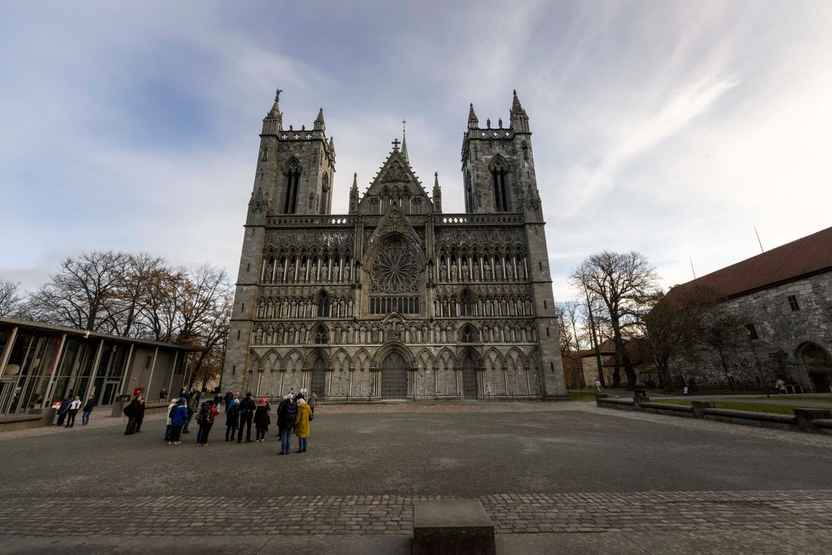 A panoramic view of the main facade and architectural structure of Nidaros Cathedral is being showcased in the historical area of Trondheim, Norway, on November 7, 2023. This architectural and religious monument is serving as an important place of pilgrimage and devotion for centuries. The construction of the cathedral, which began in the 11th century on the tomb of Olaf II, the patron saint of Norway, is continuing to make Nidaros Cathedral an architectural masterpiece and a symbol of historical significance. Its beauty and religious importance are maintaining its status as one of the country's most outstanding cultural destinations. (Photo by Jorge Mantilla/NurPhoto) (Photo by Jorge Mantilla / NurPhoto via AFP)