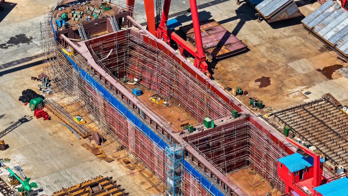 An aerial view shows a production scene at a shipyard in Yangzhou City, Jiangsu Province, China, on August 31, 2025. (Photo by Costfoto/NurPhoto) (Photo by CFOTO / NurPhoto via AFP)
