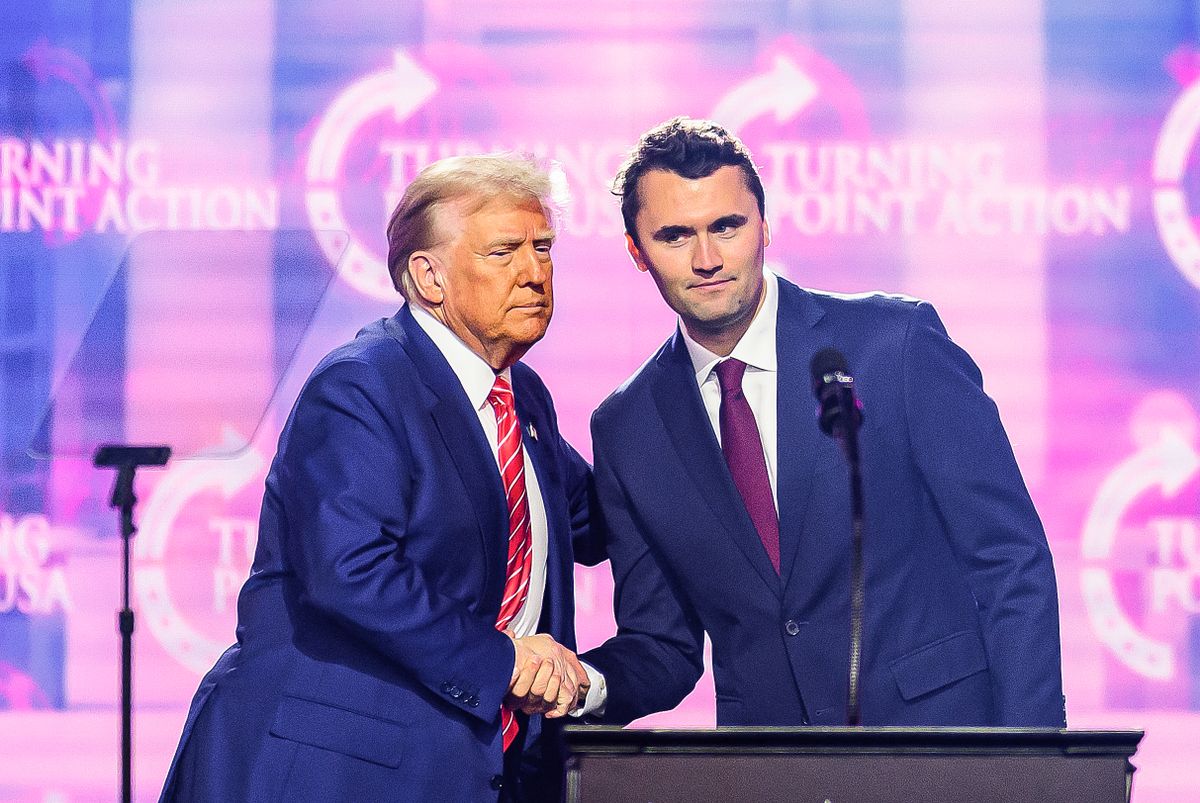 US right-wing activist Charlie Kirk (R) speaks on stage with President Donald Trump at America Fest 2024 in Phoenix, Arizona, on December 22, 2024. Right-wing youth activist and influencer Charlie Kirk, a major ally of President Donald Trump, was shot dead on September 10, 2025 in a murder that sparked fears of more political violence in an increasingly febrile United States. Trump confirmed on social media that Kirk, 31, had died from his injuries. (Photo by JOSH EDELSON / AFP)