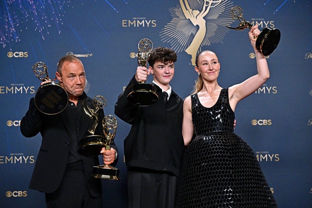 (L-R) British actor Stephen Graha poses in the press room with the awards for Outstanding Limited or Anthology Series, Outstanding Lead Actor in a Limited or Anthology Series or Movie, Outstanding Writing for a Limited Series or Anthology Series or Movie for "Adolescence", British actor Owen Cooper poses in the press room with the award for Outstanding Supporting Actor in a Limited or Anthology Series or Movie for "Adolescence" and British actress Erin Doherty poses in the press room with the award for Outstanding Supporting Actress in a Limited or Anthology Series or Movie award for "Adolescence" during the 77th Primetime Emmy Awards at the Peacock Theatre at LA Live in Los Angeles on September 14, 2025. (Photo by Frederic J. Brown / AFP) / RESTRICTED TO EDITORIAL USE