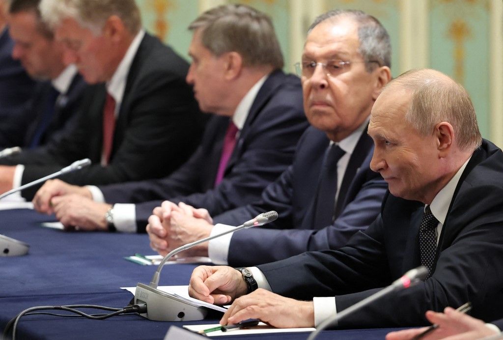 In this pool photograph distributed by the Russian state agency Sputnik, Russia's President Vladimir Putin (R) and Russia's Foreign Minister Sergei Lavrov (2nd R) attends a meeting with Iran's president on the sidelines of the Shanghai Cooperation Organisation (SCO) Summit in Tianjin on September 1, 2025. (Photo by Alexander KAZAKOV / POOL / AFP)