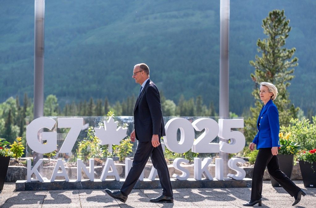 German Chancellor Friedrich Merz and European Union President Ursula von der Leyen arrive for a family photo during the Group of Seven (G7) Summit at the Kananaskis Country Golf Course in Kananaskis, Alberta, Canada on June 16, 2025. (Photo by Michael Kappeler / POOL / AFP)
