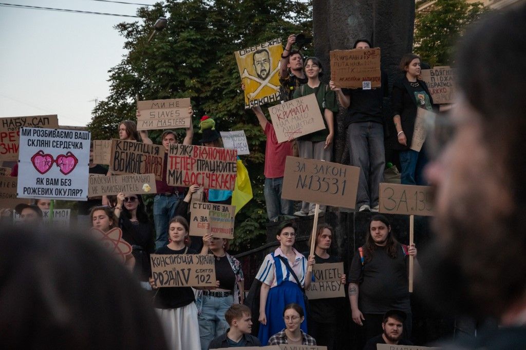 LVIV, UKRAINE - JULY 30: Protesters gather to oppose Bill No. 12414, which reduces the independence of the National Anti-Corruption Bureau of Ukraine (NABU) and the Specialized Anti-Corruption Prosecutor’s Office (SAPO) in Lviv, Ukraine, on July 30, 2025. Demonstrators, many holding placards and draped in Ukrainian flags, called on authorities to uphold anti-corruption safeguards ahead of a new parliamentary vote on Bill No. 13533, scheduled for July 31. The protest comes after President Volodymyr Zelensky signed Bill No. 12414 into law on July 23, despite widespread public and EU criticism. Olena Znak / Anadolu (Photo by Olena Znak / Anadolu via AFP)