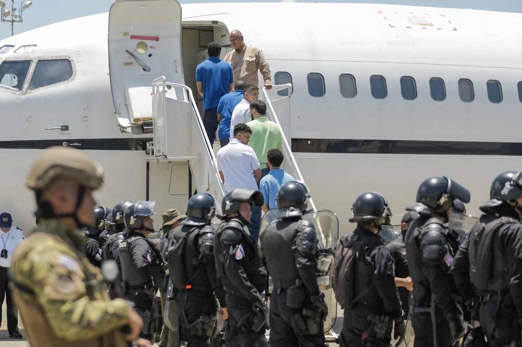 SAN SAN LUIS TALPA, LA PAZ, EL SALVADOR– JULY 18: (----EDITORIAL USE ONLY - MANDATORY CREDIT - 'EL SALVADOR PRESIDENCY / HANDOUT' - NO MARKETING NO ADVERTISING CAMPAIGNS - DISTRIBUTED AS A SERVICE TO CLIENTS----) Venezuelan migrants accused by the U.S. of belonging to the Tren de Aragua criminal gang are seen being transferred from the Terrorism Confinement Center (Cecot) in El Salvador before being repatriated to Caracas on July 18, 2025 in La Paz, El Salvador. Salvadoran President Nayib Bukele announced that more than 250 Venezuelans deported by the Trump administration in March were sent back to Venezuela in exchange for the release of 10 U.S. citizens and several Venezuelan political prisoners. The migrants were flown to Maiquetia Venezuela, as confirmed by U.S. Secretary of State Marco Rubio. El Salvador Press Presidency Office / Anadolu (Photo by El Salvador Press Presidency Off / Anadolu via AFP)
