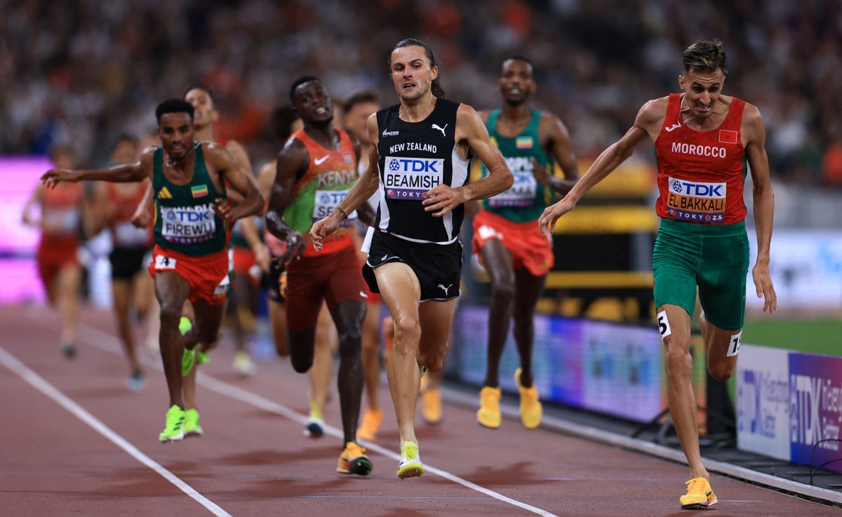 Geordie BEAMISH of New Zealand (front center) and Soufiane EL BAKKALI of Morocco (R) compete in the men's 3000 meters steeplechase final at the World Athletics Championships at Japan National Stadium in Tokyo, on Monday, September 15, 2025. BEAMISH won the race. ( The Yomiuri Shimbun ) (Photo by Takuya MATSUMOTO / The Yomiuri Shimbun via AFP)
