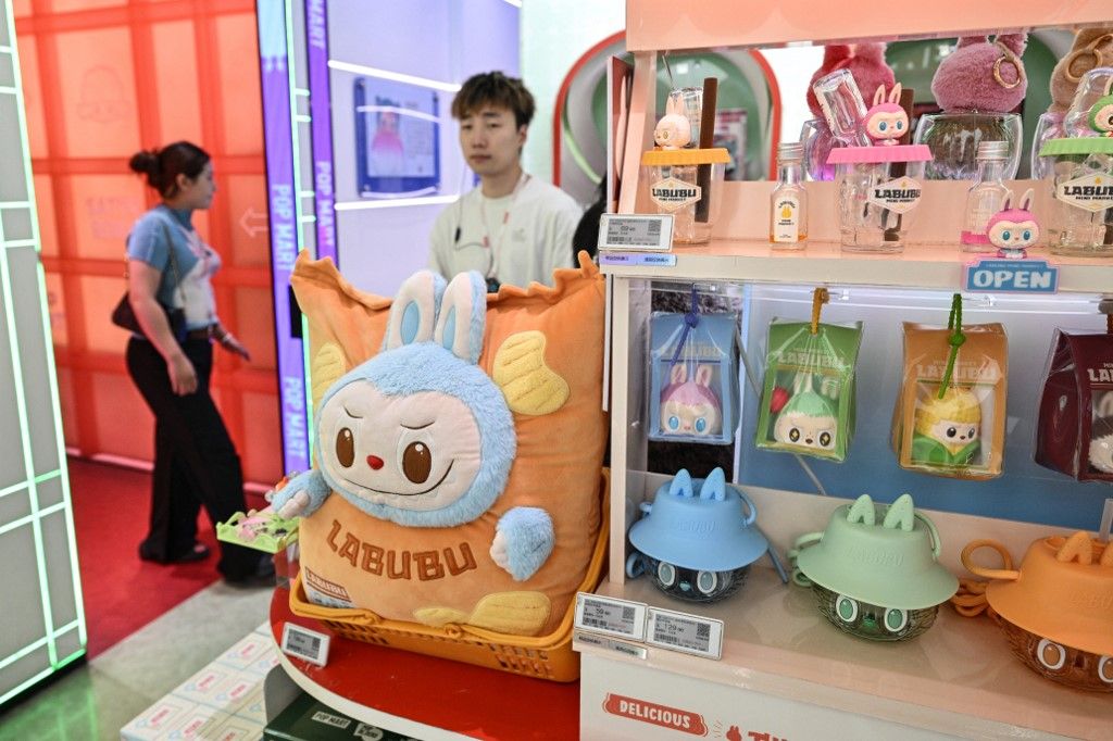 Labubu toys are displayed in a Pop Mart shop in Shanghai on August 29, 2025. (Photo by Hector RETAMAL / AFP) hamis