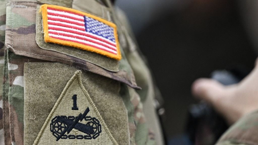 KRAKOW, POLAND  SEPTEMBER 13: 
U.S. Army and 1st Armored Division Old Ironsides patches are seen on the sleeve of an American soldier participating in the celebrations of Land Forces Day and the presentation of the banner to the command of the 2nd Polish Corps  Land Component Command, in Krakow, Lesser Poland Voivodeship, Poland, on September 13, 2025. (Photo by Artur Widak/NurPhoto) (Photo by Artur Widak / NurPhoto via AFP)