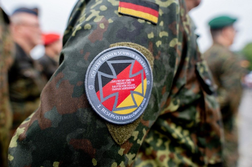 15 June 2025, Lower Saxony, Vechta: A reservist wears a badge with the inscription "I have reaffirmed my oath" and the addition "1st Reservist Pledge 2025" on his uniform during a reservist roll call on National Veterans Day. Every year on this day, the service, commitment and achievements of soldiers in the Bundeswehr who are or have been deployed are honored. Photo: Hauke-Christian Dittrich/dpa (Photo by Hauke-Christian Dittrich / dpa Picture-Alliance via AFP)