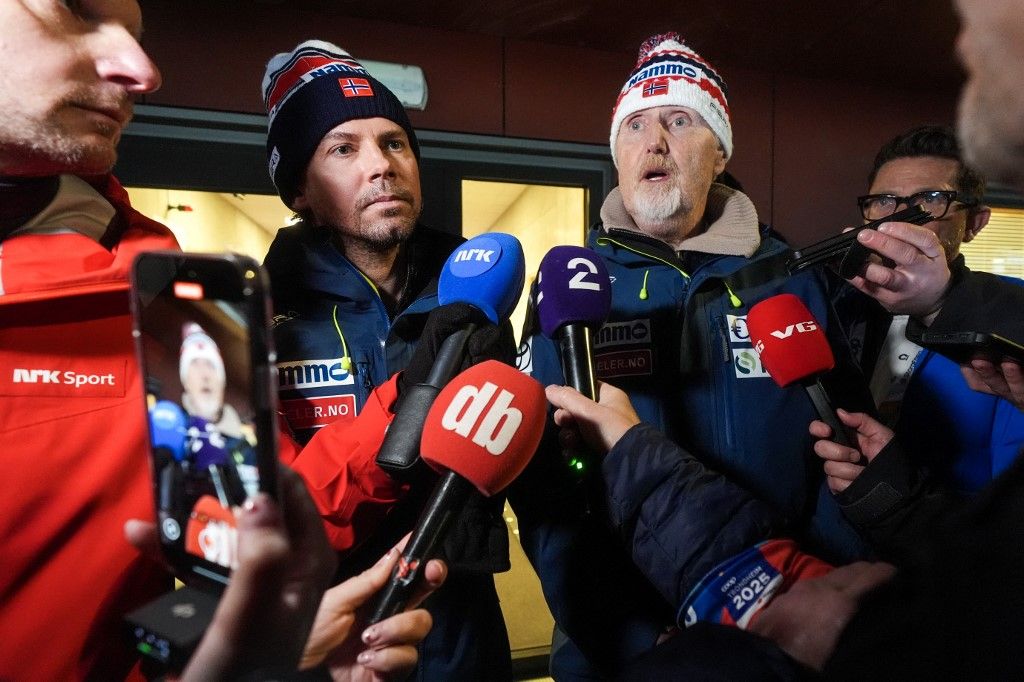 The Norwegian ski jumping national team's coach Magnus Brevig (left) and sport director Jan-Erik Aalbu deliver a press statement in Granaasen, Norway, on March 8, 2025, after two Norwegian jumpers were disqualified and accused of cheating after the men's large hill jumping competition during the World Ski Championships in Trondheim. (Photo by Terje Pedersen / NTB / AFP) / Norway OUT
