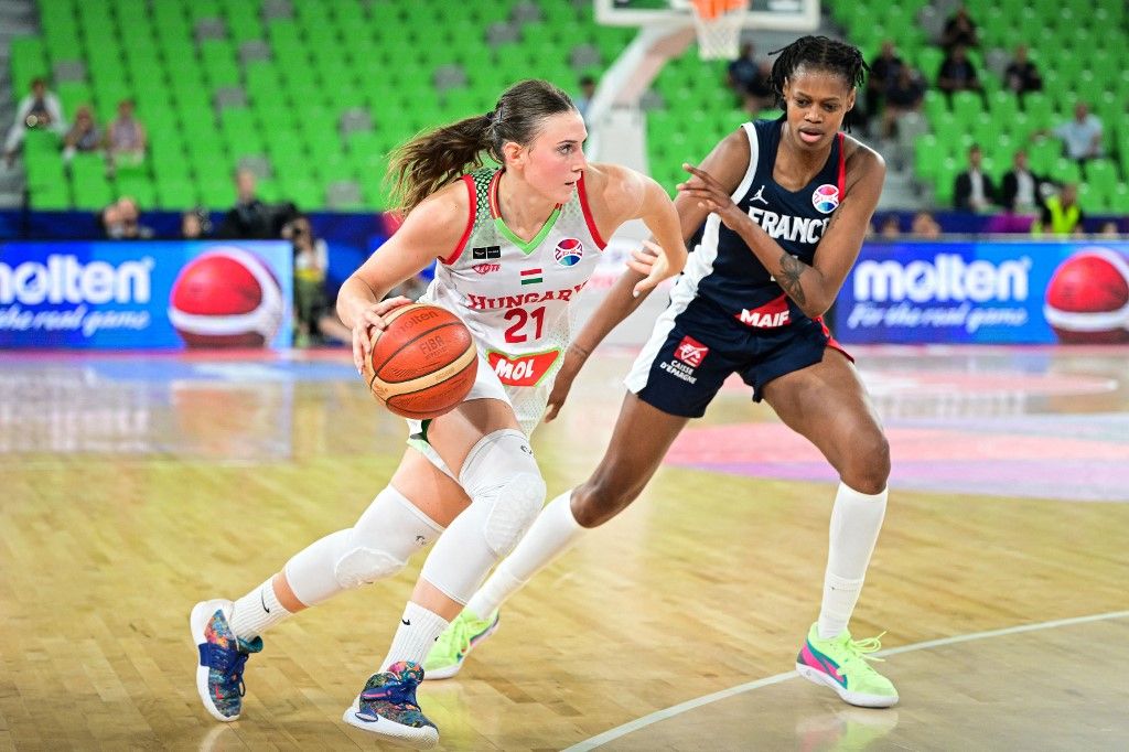 Hungarys Reka Lelik (L) fights for the ball with Frances Valeriane Vukosavljevic during the FIBA Women's Eurobasket 2023 third place match between Hungary and France at the Arena Stozice in Ljubljana, on June 25, 2023. (Photo by Jure Makovec / AFP)
