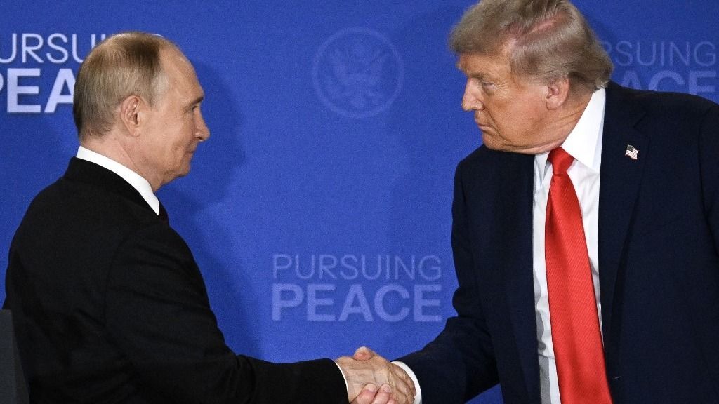 US President Donald Trump (R) and Russian President Vladimir Putin shake hands at the end of a joint press conference after participating in a US-Russia summit on Ukraine at Joint Base Elmendorf-Richardson in Anchorage, Alaska, on August 15, 2025. (Photo by Drew ANGERER / AFP)
