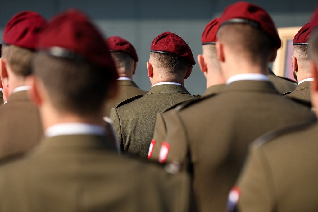 In Krakow, Poland, on October 3, 2025, soldiers participate in the official celebrations of the 6th Airborne Brigade Day at the Polish Aviation Museum. On the occasion of the 6th Airborne Brigade Day, named after Brigadier General Stanislaw Sosabowski, a ceremonial assembly takes place at the Polish Aviation Museum. During the event, decorations are awarded, followed by a parade featuring a parachute jump demonstration. The celebration also includes stands prepared by various uniformed services for participants. (Photo by Klaudia Radecka/NurPhoto) (Photo by Klaudia Radecka / NurPhoto via AFP)