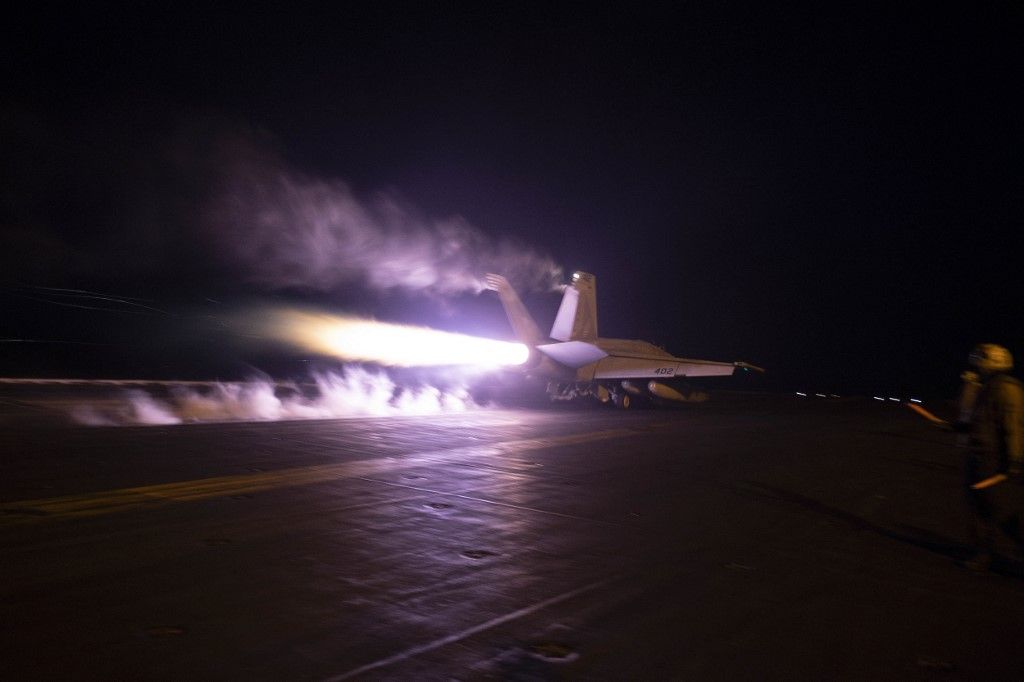 This handout picture released by the US Navy and taken on January 22, 2024 shows flight operations from the USS Dwight D. Eisenhower (CVN 69) in response to increased Iranian-backed Houthi malign behavior in the Red Sea. Yemen's Huthi rebels launched missiles at ships in the Red Sea on January 24, 2024, but two were intercepted and the third missed, the White House said. (Photo by Kaitlin Watt / US NAVY / AFP) / RESTRICTED TO EDITORIAL USE - MANDATORY CREDIT "AFP PHOTO / US NAVY / Mass Communication Specialist 3rd Class Kaitlin Watt  " - NO MARKETING NO ADVERTISING CAMPAIGNS - DISTRIBUTED AS A SERVICE TO CLIENTS