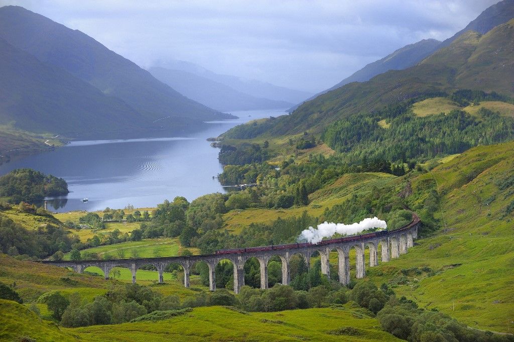 United Kingdom, Scotland, Highland, the Jacobite Steam Train, better known now as the Harry Potter Train, crossing the viaduct of Glenfinnan with loch Shiel in the background (Photo by BOISVIEUX Christophe / hemis.fr / Hemis via AFP)