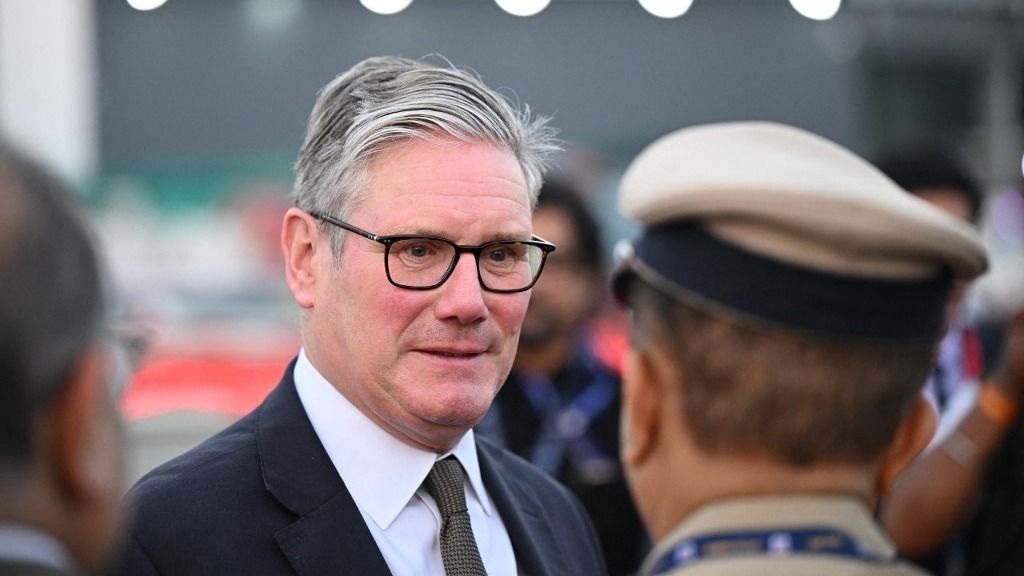 Britain's Prime Minister Keir Starmer arrives at Chhatrapati Shivaji Maharaj International Airport in Mumbai on October 8, 2025. Starmer arrived in India to meet his counterpart Narendra Modi and promote the recently signed trade deal with the south Asian nation. (Photo by Leon Neal / POOL / AFP)