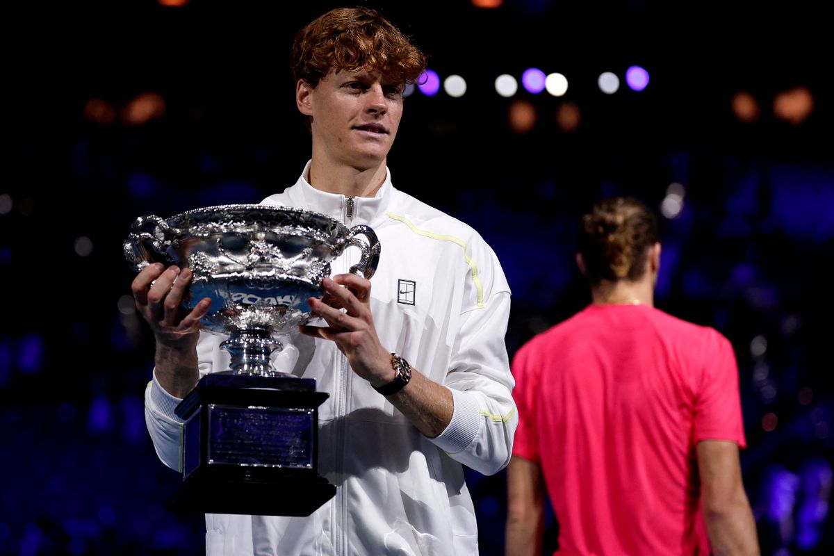 Italy's Jannik Sinner celebrates with the Norman Brookes Challenge Cup trophy after defeating Germany's Alexander Zverev during their men's singles final match on day fifteen of the Australian Open tennis tournament in Melbourne on January 26, 2025. (Photo by Martin KEEP / AFP) / -- IMAGE RESTRICTED TO EDITORIAL USE - STRICTLY NO COMMERCIAL USE --