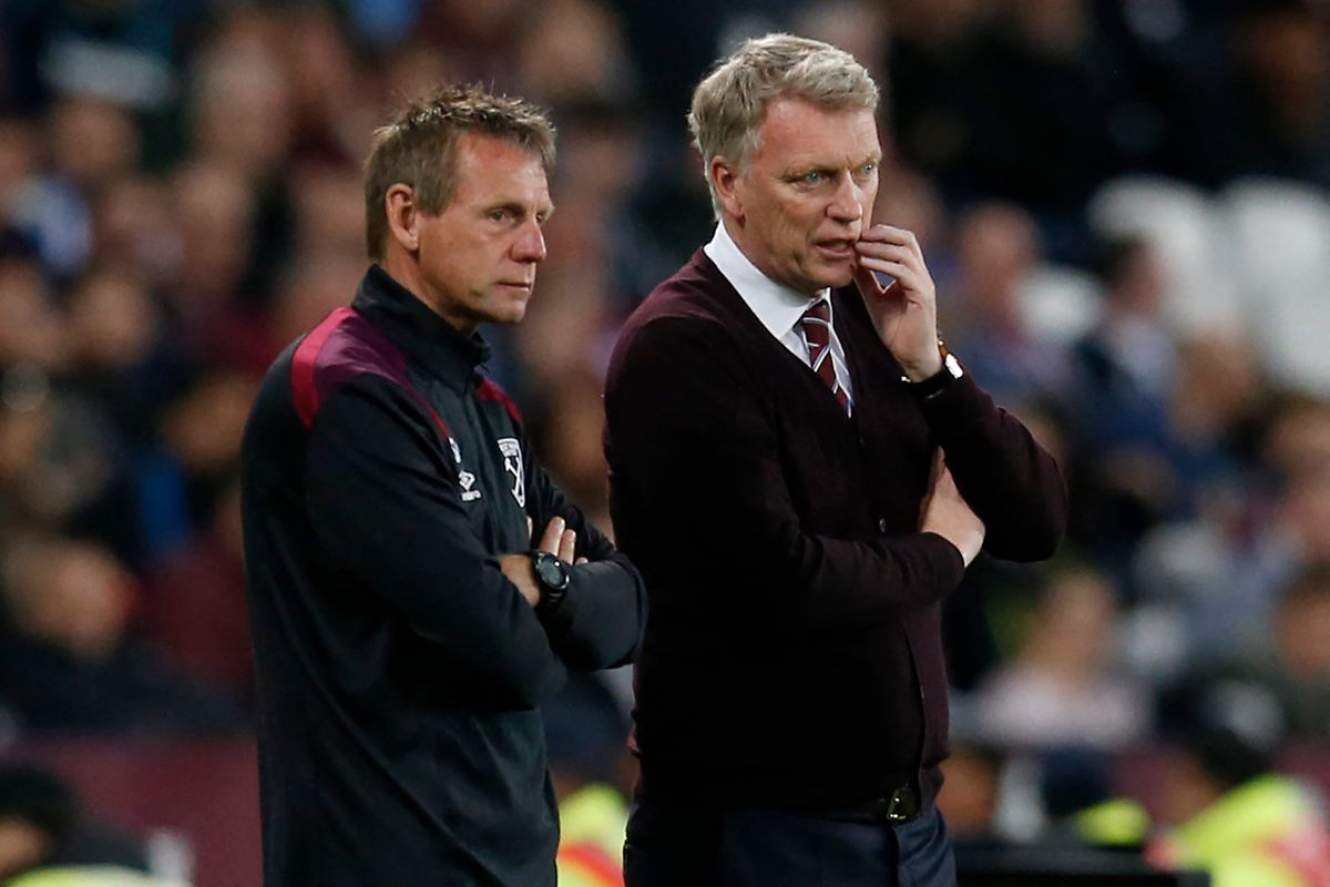West Ham United's assistant manager Stuart Pearce (L) talks with West Ham United's Scottish manager David Moyes during the English Premier League football match between West Ham United and Manchester United at The London Stadium, in east London on May 10, 2018. (Photo by Ian KINGTON / AFP) / RESTRICTED TO EDITORIAL USE. No use with unauthorized audio, video, data, fixture lists, club/league logos or 'live' services. Online in-match use limited to 75 images, no video emulation. No use in betting, games or single club/league/player publications. /
