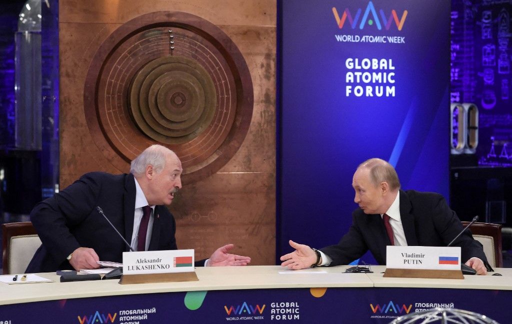 Russia's President Vladimir Putin speaks with Belarus' President Alexander Lukashenko (L) during the World Atomic Week international forum, dedicated to the global nuclear industry, in Moscow on September 25, 2025. (Photo by Evgenia Novozhenina / POOL / AFP)