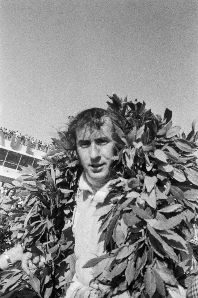 Scottish F1 World Champion Jacky Stewart wears a laurel wreath on the podium after winning the French Grand Prix on July 4, 1971 at Le Castellet, southern France. (Photo by AFP)