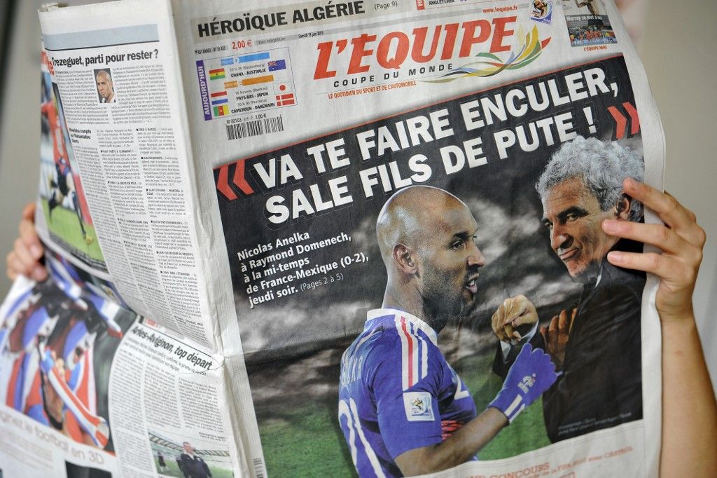 A person reads French sport newspaper L'Equipe on June 19, 2010 in Strasbourg. France striker Nicolas Anelka was kicked out of the World Cup on Saturday after reportedly launching a tirade of abuse at coach Raymond Domenech, according the French Football Federation (FFF). The 31-year-old Chelsea forward is reported to have told Domenech to "go screw yourself, dirty son of a whore" in the dressing room after the coach took issue with his first-half performance against Mexico, sports daily L'Equipe claimed. AFP PHOTO / JOHANNA LEGUERRE (Photo by JOHANNA LEGUERRE / AFP)