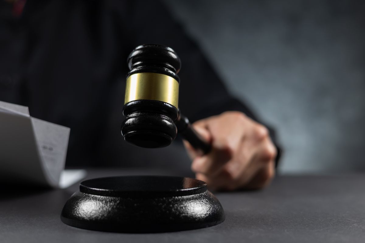 Judge hold wooden gavel, a wooden legal gavel on an office desk, Judge gavel, Law.