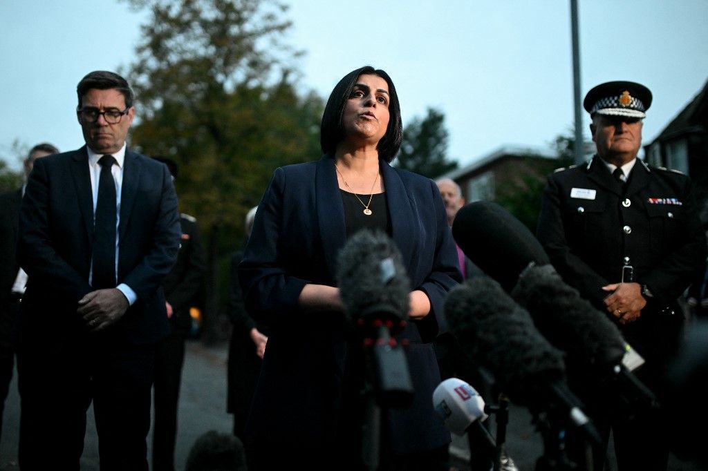 Britain's Home Secretary Shabana Mahmood speaks to members of the media near to Heaton Park Hebrew Congregation synagogue in Crumpsall, north Manchester, on October 2, 2025, following an attack at the synagogue. Two people were killed and three wounded in a car ramming and stabbing incident outside a synagogue in Manchester, northwest England, on Thursday, police said. "A man believed to be the offender was shot by GMP (Greater Manchester Police) Firearms Officers and is also believed to be deceased," the force said on X, adding his death could not yet be confirmed due to "suspicious items on his person". (Photo by Oli SCARFF / AFP)