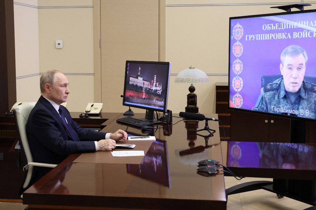 In this pool photograph distributed by Russian state agency Sputnik, Russia's President Vladimir Putin attends a meeting with Chief of the General Staff of the Russian Armed Forces Valery Gerasimov via videoconference at the Novo-Ogaryovo state residence outside Moscow on April 26, 2025. (Photo by Alexander KAZAKOV / POOL / AFP)