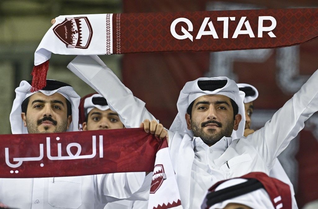 Fans of Qatar cheer for their team before the FIFA World Cup 2026 AFC Asian qualifiers playoffs group A match between Qatar and the United Arab Emirates at Jassim Bin Hamad Stadium in Doha, Qatar, on October 14, 2025. (Photo by Noushad Thekkayil/NurPhoto) (Photo by Noushad Thekkayil / NurPhoto via AFP)