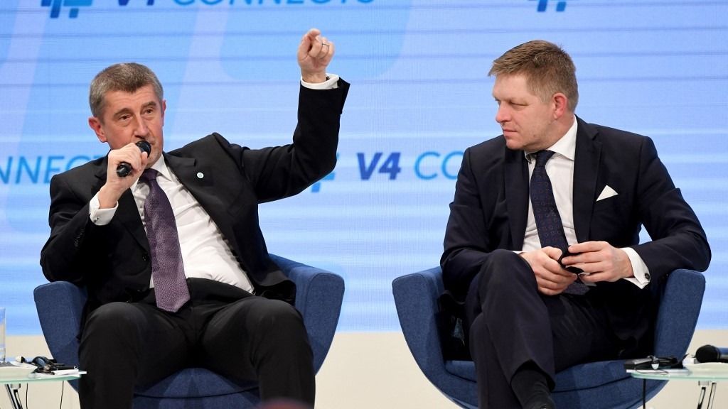 Prime Minister Andrej Babis (L) of Czech Republic speaks as his counterpart Robert Fico (R) of Slovakia listens in the Varkert Bazar (the building of the Royal Palace) of Budapest on January 26, 2018 during a panel discussion of Visegrads countries (V4) prime ministers. (Photo by Attila KISBENEDEK / AFP)