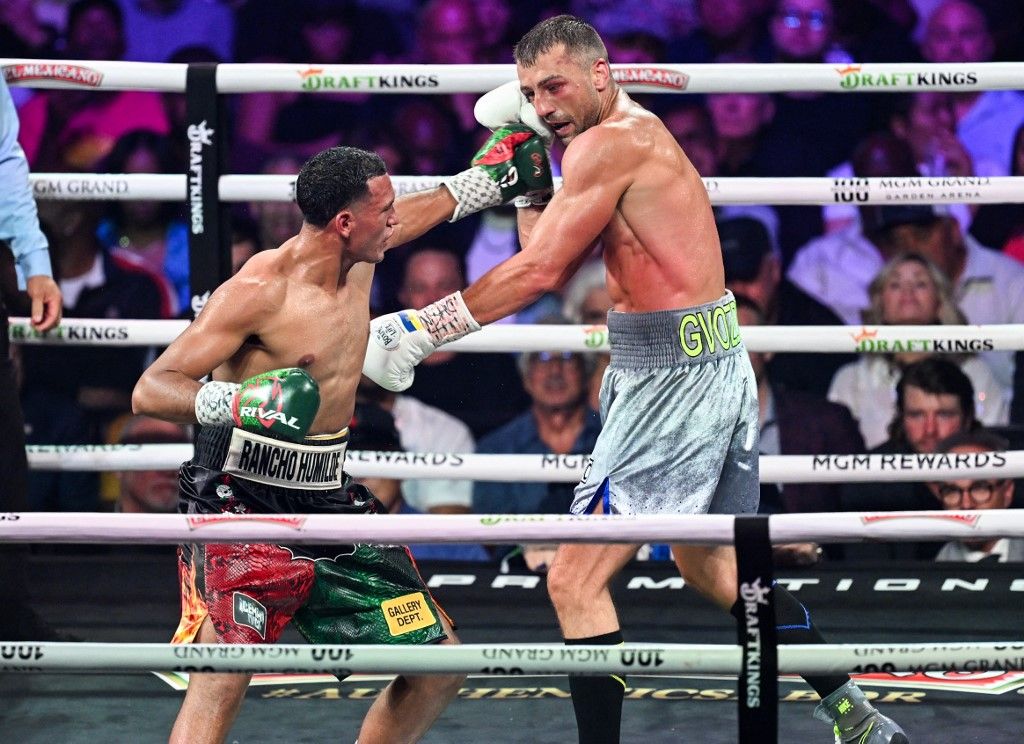 LAS VEGAS, NEVADA - JUNE 15: David Benavidez (in black&red short) from Phoenex, Arizona and Oleksandr Gvozdyk (in gray short) from Kharkiv, Ukraine exchange punches during their WBC interim world light heavyweight title of the Premiere Boxing Championship on Saturday night at the MGM Grand Garden Arena in Las Vegas, Nevada, United States on June 15, 2024. Tayfun Coskun / Anadolu (Photo by Tayfun Coskun / Anadolu via AFP)