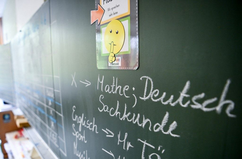 22 August 2022, Berlin: Math, German, science, English are written on the blackboard in a classroom at the school in Köllnische Heide in Neukölln. Photo: Jens Kalaene/dpa (Photo by JENS KALAENE / dpa Picture-Alliance via AFP)