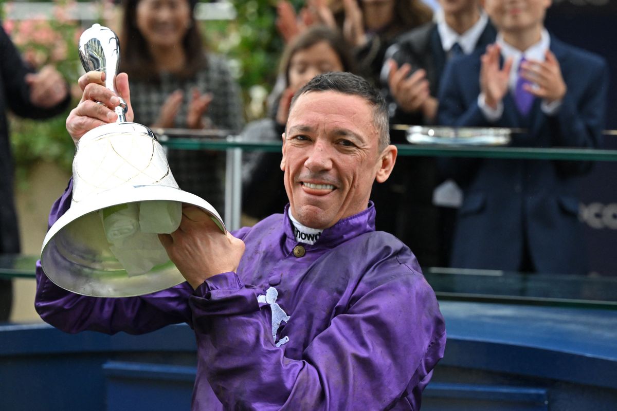 Italian jockey Frankie Dettori poses with his trophy at the presentation ceremony after his victory on King of Steel in the Champion Stakes on Qipco British Champions Day at Ascot Racecourse, west of London on October 21, 2023. Champions day is the finale of the British flat racing season and the UK's richest raceday, and will be legendary jockey Frankie Dettori's final day of racing in Great Britain. (Photo by Glyn KIRK / AFP)