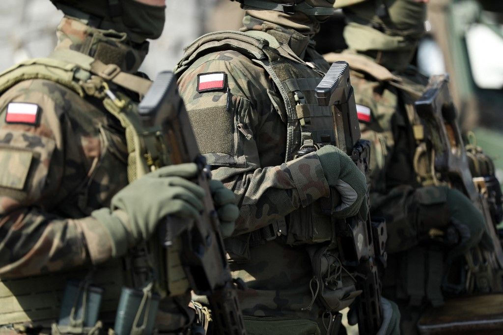 In Krakow, Poland, on October 3, 2025, soldiers participate in the official celebrations of the 6th Airborne Brigade Day at the Polish Aviation Museum. On the occasion of the 6th Airborne Brigade Day, named after Brigadier General Stanislaw Sosabowski, a ceremonial assembly takes place at the Polish Aviation Museum. During the event, decorations are awarded, followed by a parade featuring a parachute jump demonstration. The celebration also includes stands prepared by various uniformed services for participants. (Photo by Klaudia Radecka/NurPhoto) (Photo by Klaudia Radecka / NurPhoto via AFP)