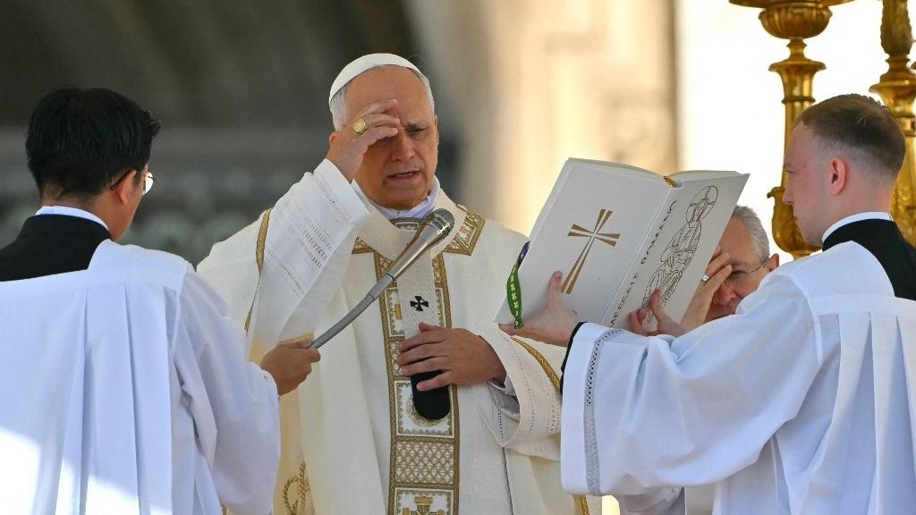 Pope Leo XIV (C) gestures as he leads the mass during the Solemnity of All Saints with the Rite of Proclamation of Saint John Henry Newman as a "Doctor of the Church" on the occasion of the Jubilee of the World Education on All Saints' Day at St. Peter's square, in The Vatican on November 1, 2025. (Photo by Andreas SOLARO / AFP)