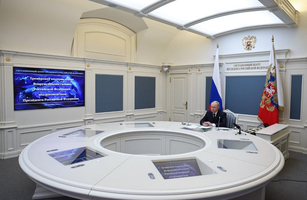 In this pool photograph distributed by the Russian state agency Sputnik, Russia's President Vladimir Putin oversees an exercise of the country's nuclear forces via a videolink in Moscow on October 22, 2025. (Photo by Alexander KAZAKOV / POOL / AFP)