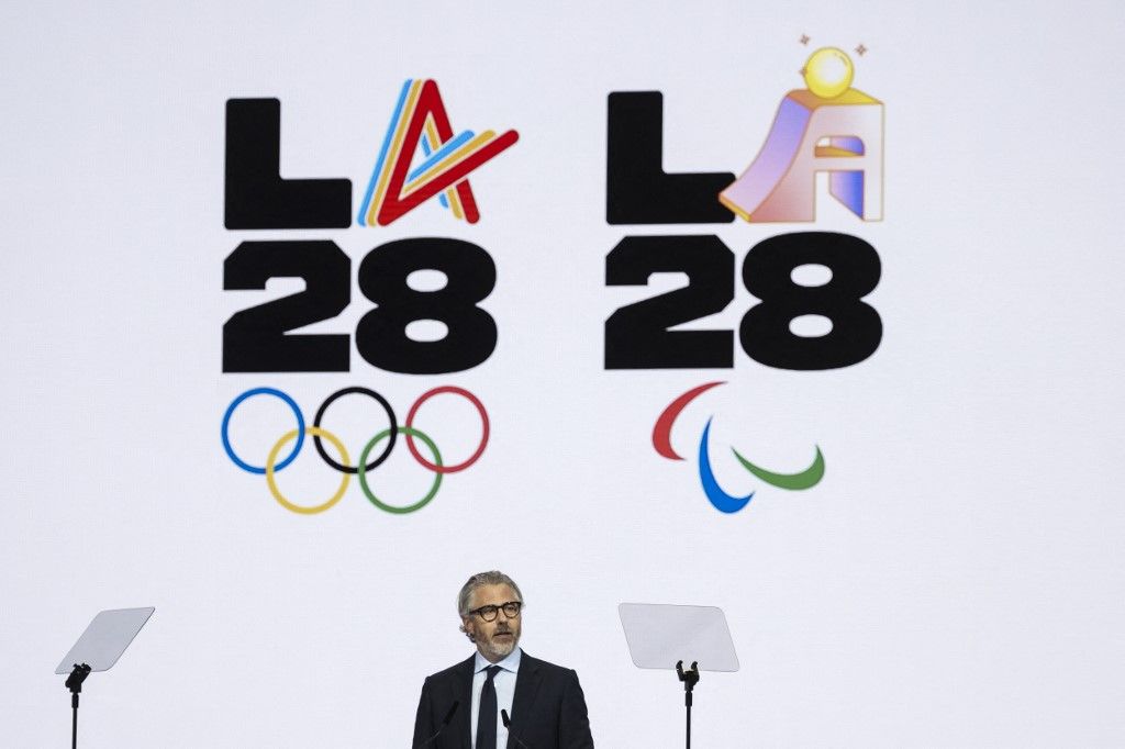Los Angeles 2028 Olympics chairman, Casey Wasserman speaks during the presentation of an activities report during the 144th session of the International Olympic Committee (IOC), in Costa Navarino, Greece, on the election day of the next IOC President, on March 20, 2025.  (Photo by Fabrice COFFRINI / AFP)