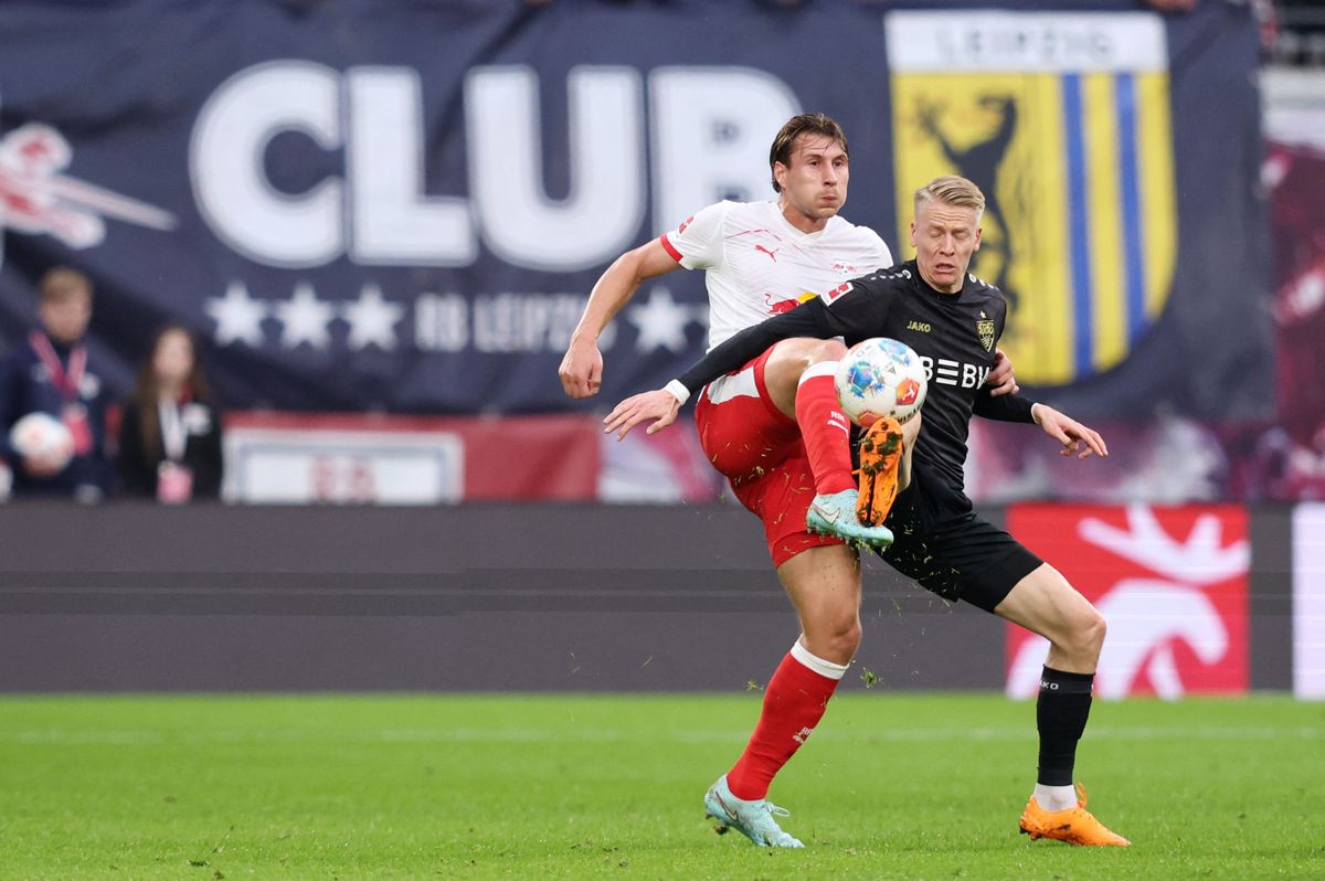 Leipzig's Hungarian defender #04 Willi Orban (L) and Stuttgart's German midfielder #10 Chris Fuehrich vie for the ball during the German first division Bundesliga football match between RB Leipzig and VfB Stuttgart in Leipzig, eastern Germany on November 1, 2025. (Photo by Ronny HARTMANN / AFP) / DFL REGULATIONS PROHIBIT ANY USE OF PHOTOGRAPHS AS IMAGE SEQUENCES AND/OR QUASI-VIDEO