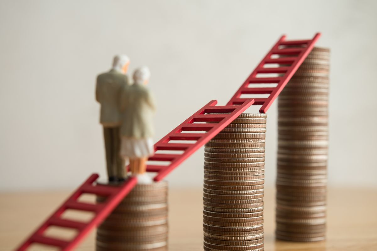 Old senior couple person walking on growth stack coins graph chart with red ladder. Financial planning for retirement, savings, pension, gain return on investment, wealth and so on concept.