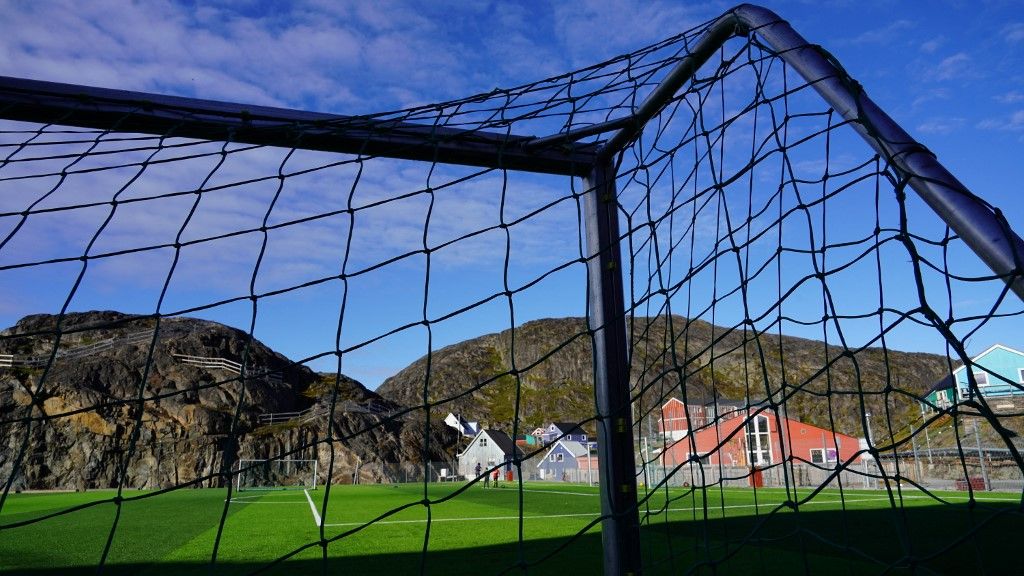 A goal net is pictured on a football pitch in Maniitsoq, Greenland on September 3, 2024. It is a virtually uninhabited territory, covered mainly in ice, and yet, in Greenland, football is king and fans, in search of recognition, want to be able to measure themselves against other nations, a chimera as long as they have not joined a continental federation. (Photo by James BROOKS / AFP) / TO GO WITH AFP STORY by James BROOKS
