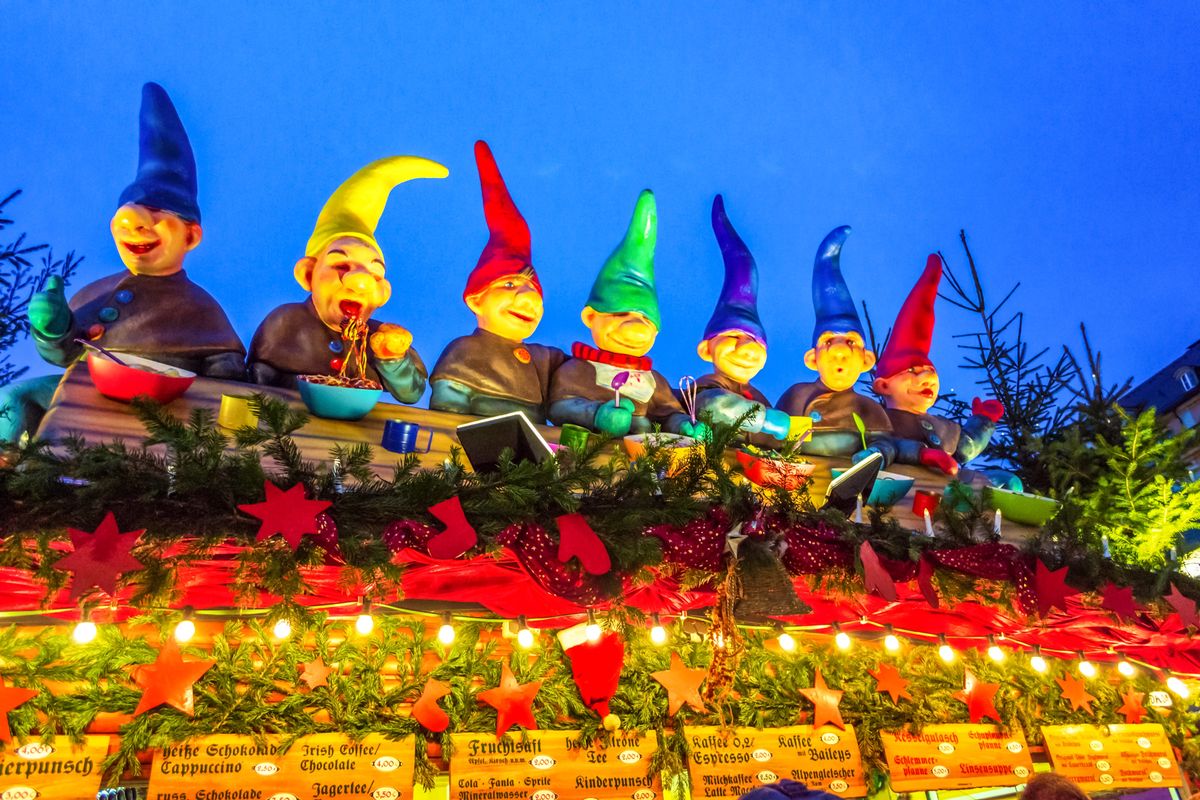 Dresden,Germany-December 19th 2014:Crowded Christmas market and beautifully decorated kiosks against cobalt blue sky in Dresden city at Christmastime