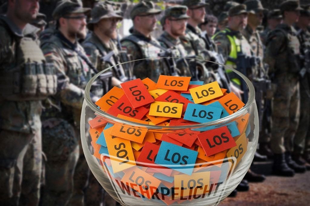 ATTENTION PHOTO MONTAGE: Symbolic photo of conscription: Lottery to determine draft selection for the new military service. Joining the Bundeswehr by lottery? If not enough volunteers sign up, this could be a solution. Soldiers on a Leopard 2 A6 battle tank, general, feature, marginal image, symbolic photo? (Photo by Malte Ossowski/SVEN SIMON / SvenSimon / dpa Picture-Alliance via AFP)