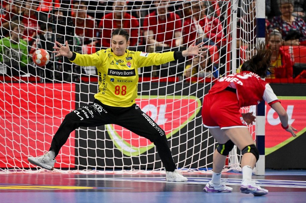Faroe Islands' goalkeeper #88 Rakul S. Wardum (L) deflects a penalty from Croatia's right back #23 Katarina Pavlovic during the women's EHF 2024 European championship handball game between Croatia and Faroe Islands at the St Jakobshalle in Basel on December 1, 2024. (Photo by Fabrice COFFRINI / AFP)