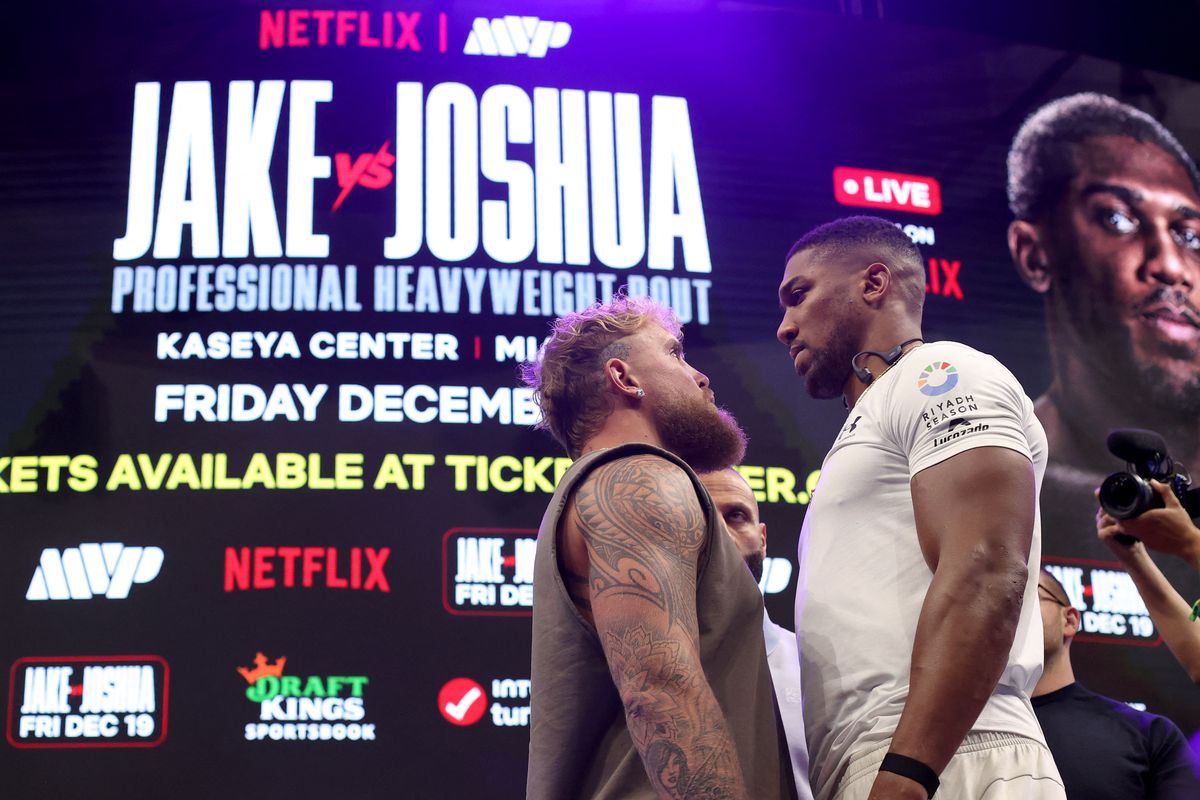 MIAMI, FLORIDA - NOVEMBER 21: Jake Paul and Anthony Joshua face off during the press conference about their exhibition match scheduled for December 19 at Kaseya Center on November 21, 2025 in Miami, Florida.   Leonardo Fernandez/Getty Images/AFP (Photo by Leonardo Fernandez / GETTY IMAGES NORTH AMERICA / Getty Images via AFP)