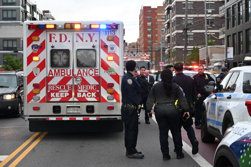 NEW YORK, UNITED STATES - APRIL 27: The FDNY and multiple Emergency Service Unit officers from the NYPD are at the scene where an NYPD police officer wounded after being grazed by a bullet during a shooting on 31st Road and 21st Street in Astoria, Queens, New York, United States on April 27, 2025. Kyle Mazza / Anadolu (Photo by Kyle Mazza / Anadolu via AFP)