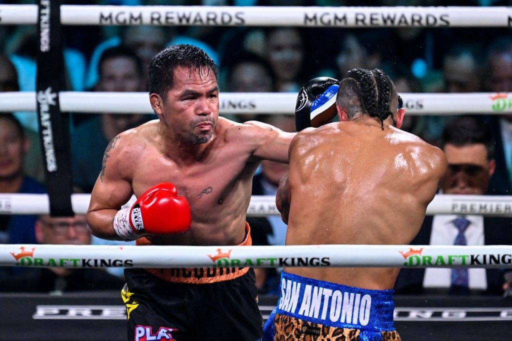 LAS VEGAS, NEVADA - JULY 19: Manny Pacquiao (in black short) and Mario Barrios (in blue short) exchange punches during their WBC welterweight championship world titles of the Premiere Boxing Championship on Saturday night at MGM Grand Garden Arena in Las Vegas, Nevada, United States on July 19, 2025. Tayfun Coskun / Anadolu (Photo by Tayfun Coskun / Anadolu via AFP)
