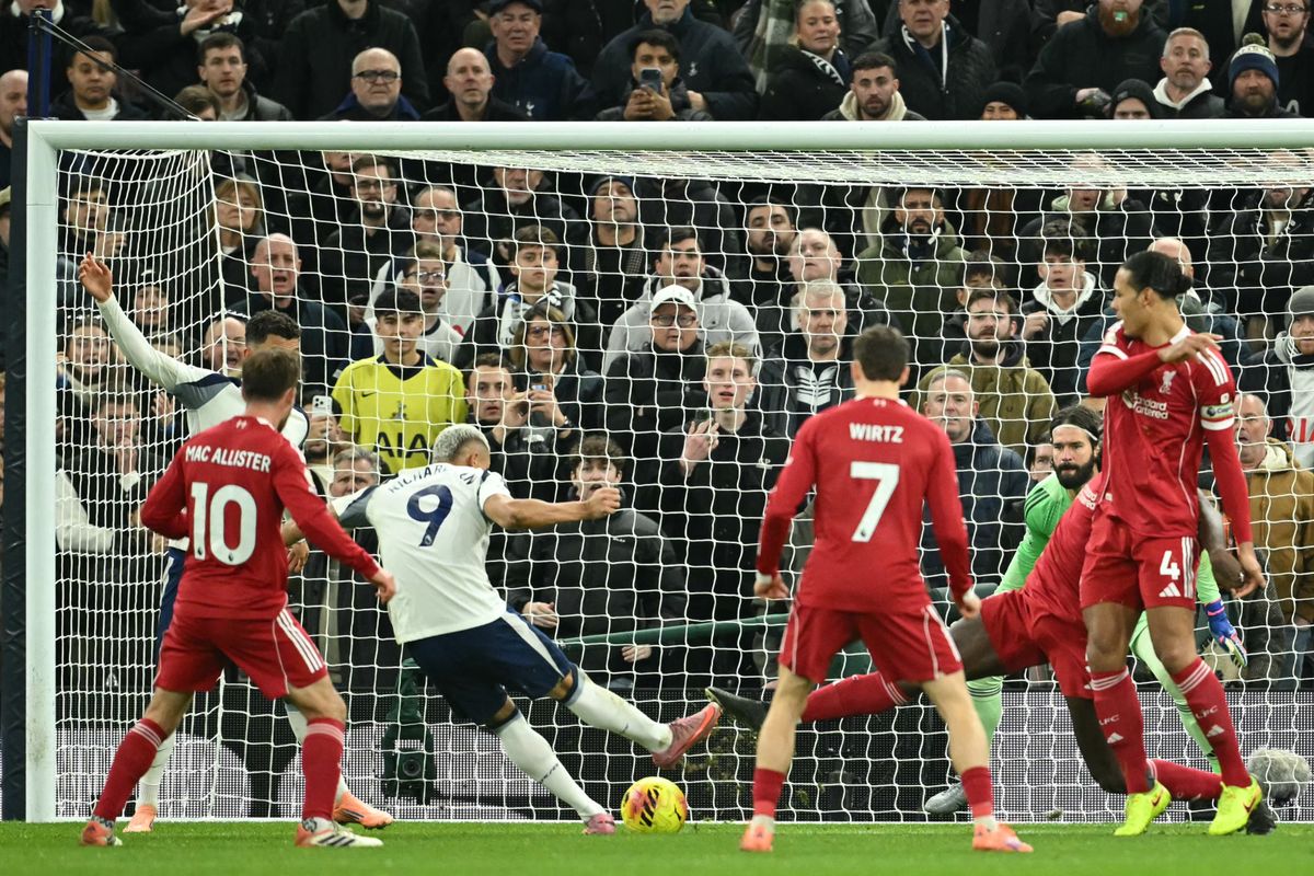 Tottenham Hotspur's Brazilian striker #09 Richarlison (3L) shoots to score their first goal for 1-2 during the English Premier League football match between Tottenham Hotspur and Liverpool at the Tottenham Hotspur Stadium in London, on December 20, 2025. (Photo by JUSTIN TALLIS / AFP) / RESTRICTED TO EDITORIAL USE. No use with unauthorized audio, video, data, fixture lists, club/league logos or 'live' services. Online in-match use limited to 120 images. An additional 40 images may be used in extra time. No video emulation. Social media in-match use limited to 120 images. An additional 40 images may be used in extra time. No use in betting publications, games or single club/league/player publications. / 